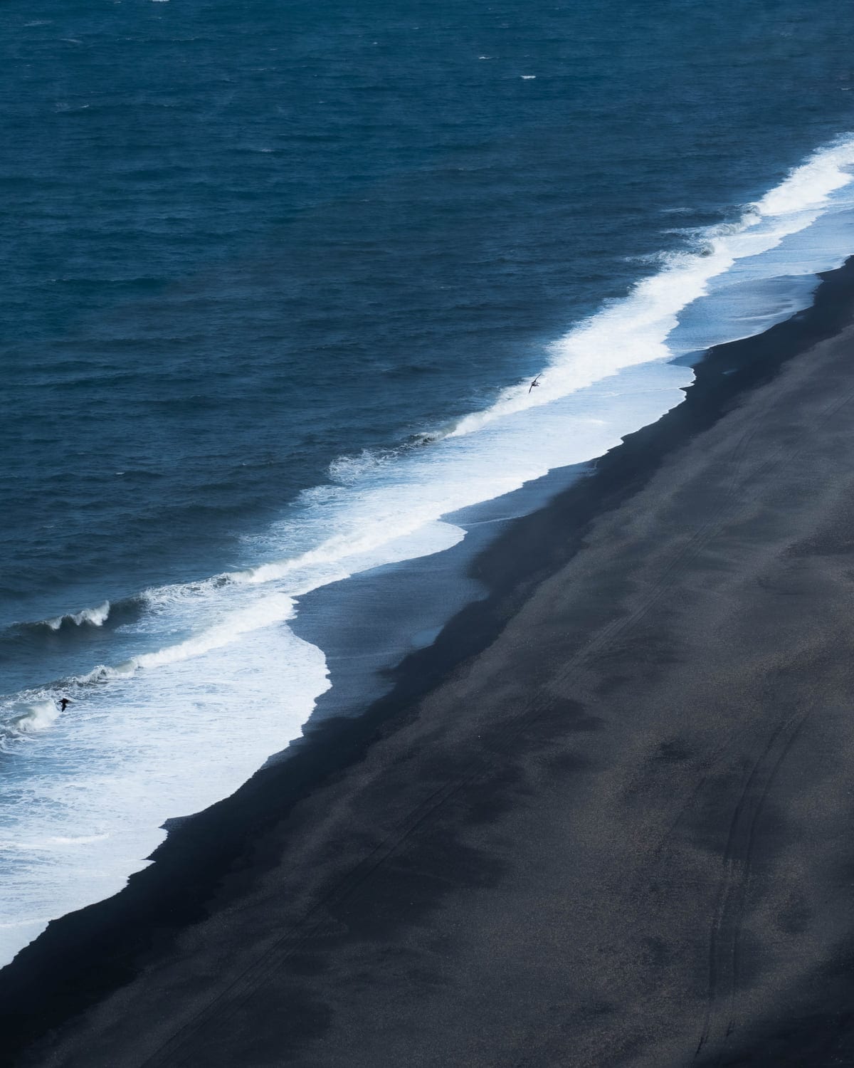 Basalt beach waves from the cliff